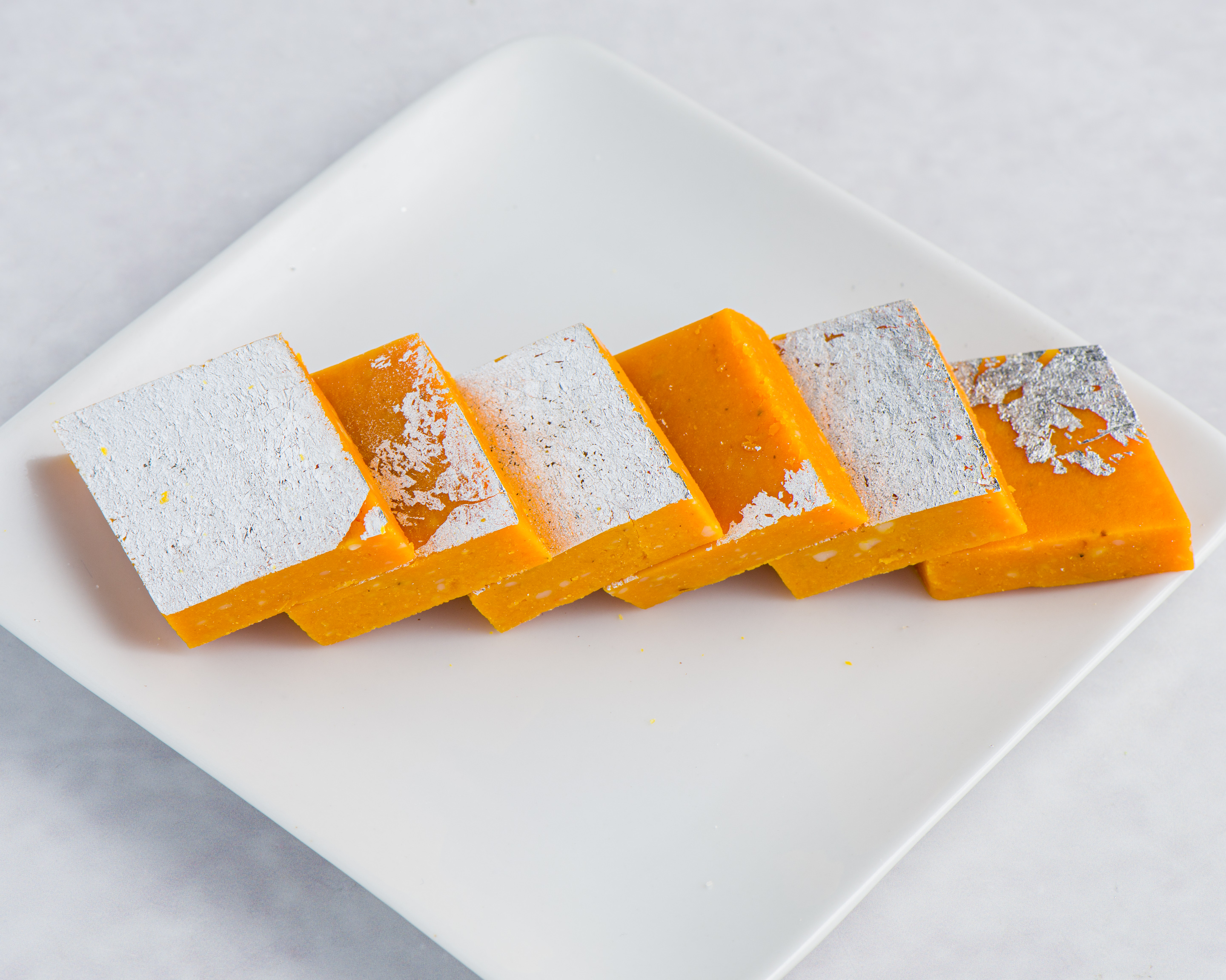 Kaju Kesar Burfi (yellow diamond shape)